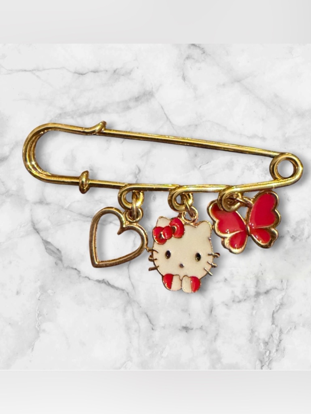 Hello Kitty Gold Tone Pin with Cream, Red & Pink Charms